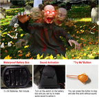 HalloWraith prop installed outdoors in a yard among tombstones and skeleton decorations
